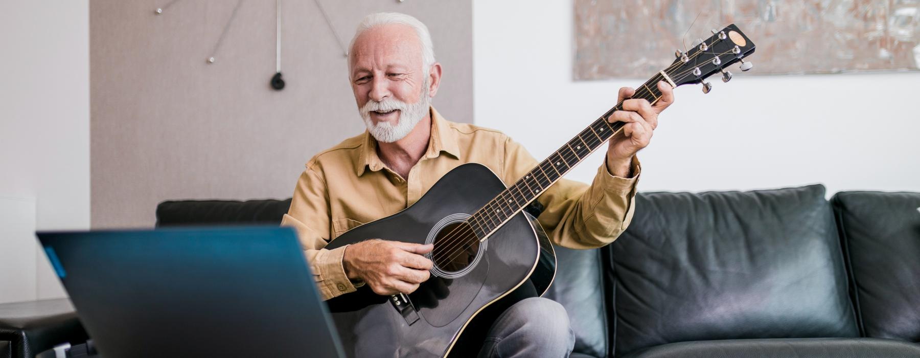 a man playing a guitar