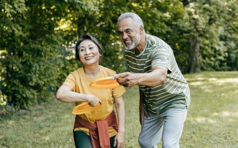 a man and a woman playing frisbee