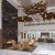 clubroom with a fireplace and chairs