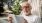man reading a book in hammock